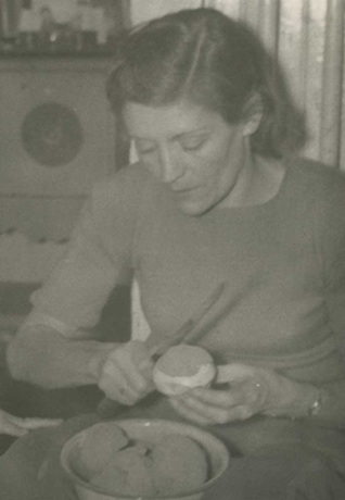 To My Dead Mother on Mother's Day Black and white photo of author's mother peeling potatoes, taken over 80 years ago—reflecting a quiet, hardworking life