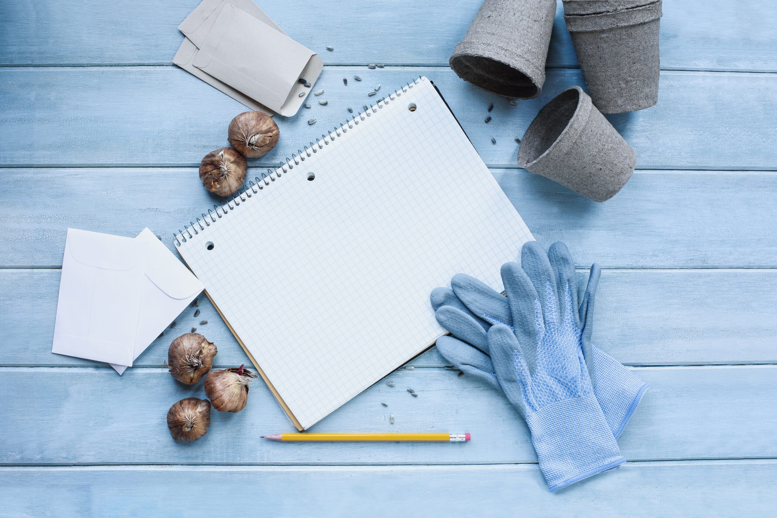 Blank,Gardening,Journal,Grid,Notebook,Surrounded,By,Garden,Gloves,,Pencil,